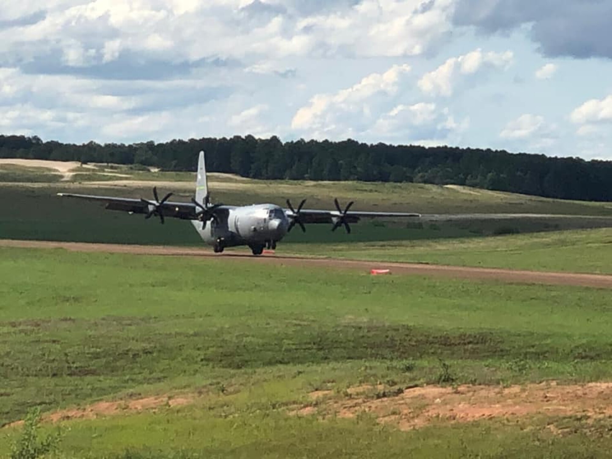 A C-130J Super Hercules aircraft from Little Rock Air Force Base, Arkansas, departs Geronimo Landing Zone in support of airborne operations at the Joint Readiness Training Center in Fort Polk, Louisiana, May 26, 2020. LRAFB aircraft conducted parachute operations from dirt assault runways May 26-28. (Courtesy photo)