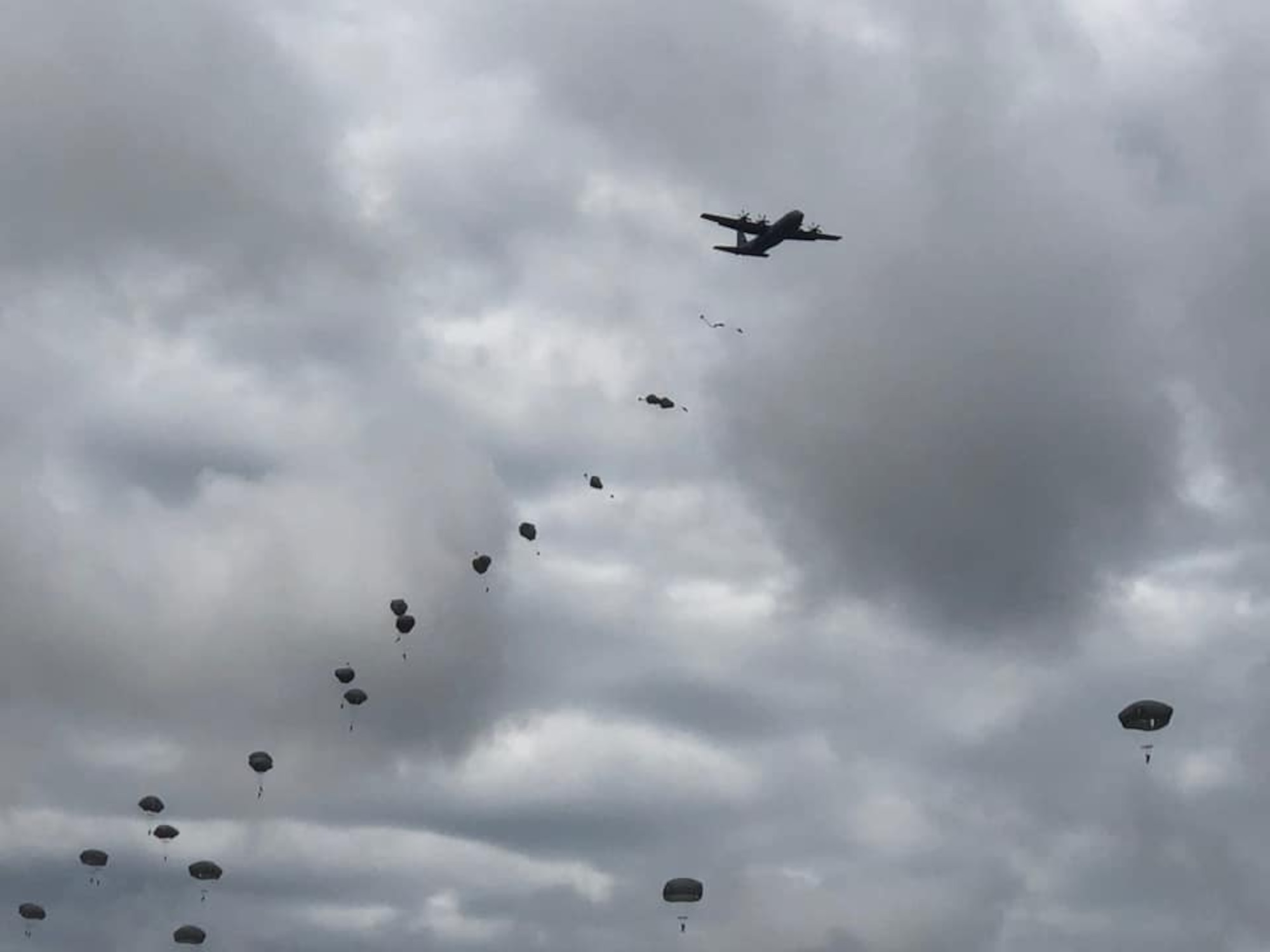 U.S. Army paratroopers descend from the sky after jumping out of C-130J Super Hercules aircraft from Little Rock Air Force Base, Arkansas, in support of airborne operations at the Joint Readiness Training Center in Fort Polk, Louisiana, May 26, 2020. The training allowed more than 140 U.S. Army Soldiers to recertify their status, both as paratroopers and jumpmasters. (Courtesy photo)
