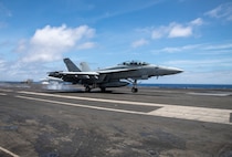 fighter jet lands on USS Harry S. Truman
