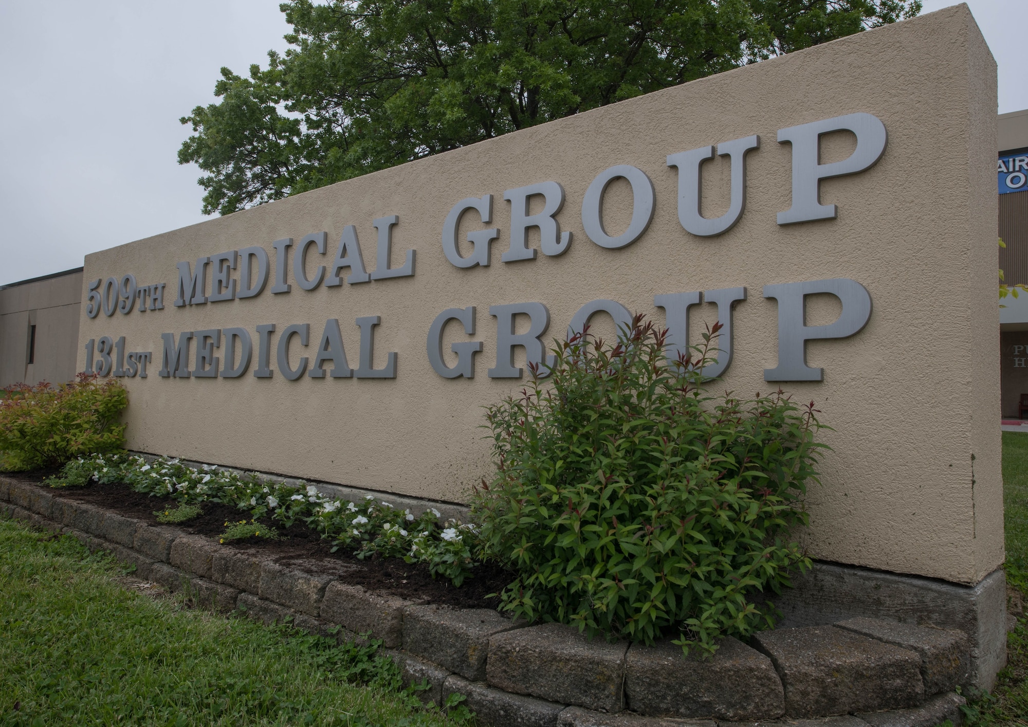 A sign displays the names of the 509th and 131st Medical Groups at Whiteman Air Force Base, Missouri, May 13, 2020. The 509th MDG implemented procedures and precautions to help mitigate the spread of COVID-19 on base and within the local community. (U.S. Air Force Photo by Senior Airman Thomas Johns)