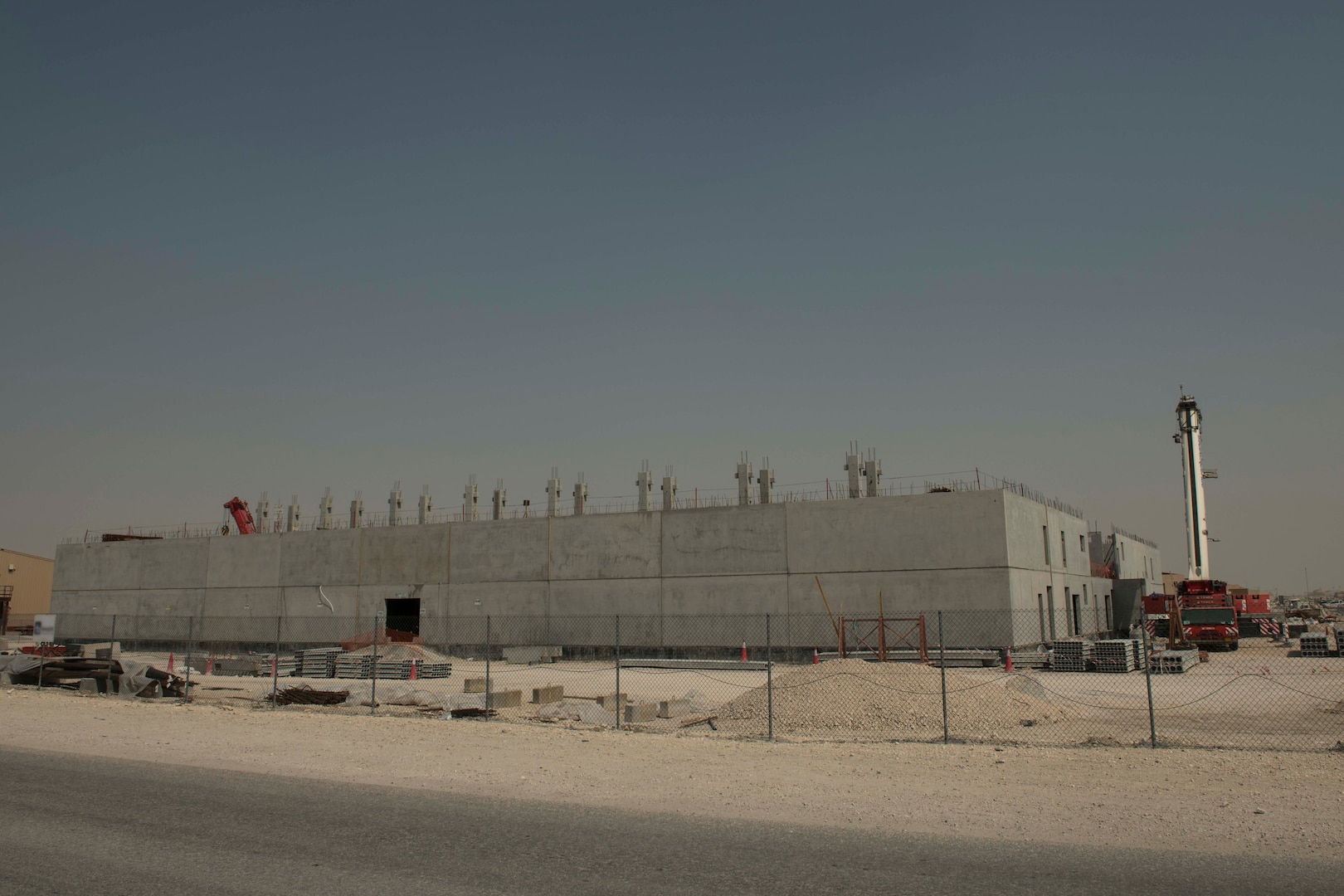 The construction of 10 state-of-the-art dormitories, two dining facilities, and four mission support facilities continues at Al Udeid Air Base, Qatar, May 29, 2020.