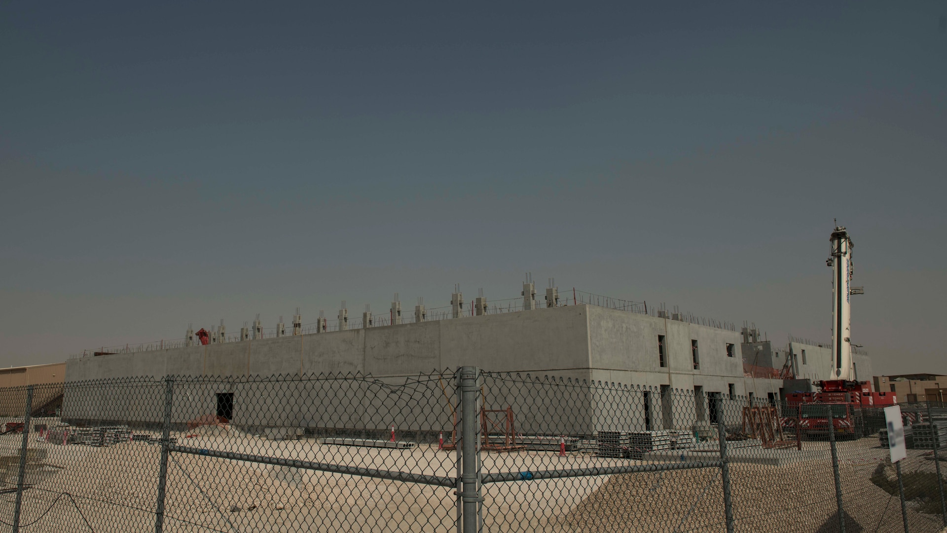 The construction of 10 state-of-the-art dormitories, two dining facilities, and four mission support facilities continues at Al Udeid Air Base, Qatar, May 29, 2020.