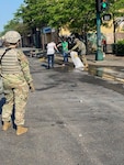 Minnesota Guardsmen took some time while they were on duty today to assist with cleaning up in the community. The Minnesota National Guard is committed to protecting lives, preserving property and restoring order.