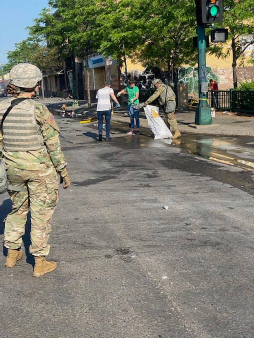 Minnesota Guardsmen took some time while they were on duty today to assist with cleaning up in the community. The Minnesota National Guard is committed to protecting lives, preserving property and restoring order.