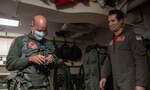 PHILIPPINE SEA (May 30, 2020) Lt. Bryan Dietel, right, assists Vice Adm. William R. Merz, commander, U.S. 7th Fleet, with donning flight gear prior to a flight on an F/A-18F Super Hornet, attached to Strike Fighter Squadron (VFA) 102, on the Navy’s only forward-deployed aircraft carrier USS Ronald Reagan (CVN 76). Merz visited the officers and crew of Ronald Reagan and Carrier Strike Group 5 to discuss the critical nature of the maritime mission in the U.S. 7th Fleet area of operations. Ronald Reagan, the flagship of Carrier Strike Group 5, provides a combat-ready force that protects and defends the United States, as well as the collective maritime interests of its allies and partners in the Indo-Pacific Region. (U.S. Navy photo by Mass Communication Specialist 3rd Class Erica Bechard)