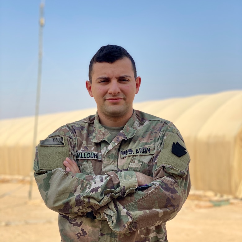 U.S. Army Spc. Fadi Mallouhi, computer/detection systems repairer with Headquarters Support Company, 628th Aviation Support Battalion, 28th Expeditionary Combat Aviation Brigade, poses for a photo at an airfield in the 28th ECAB's area of operations in the Middle East. Mallouhi, originally from the Allentown, Pennsylvania area, spent much of his childhood in Syria and passes valuable lessons about the language and culture to his fellow Soldiers.