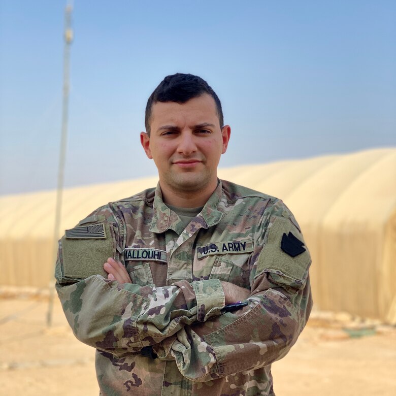 U.S. Army Spc. Fadi Mallouhi, computer/detection systems repairer with Headquarters Support Company, 628th Aviation Support Battalion, 28th Expeditionary Combat Aviation Brigade, poses for a photo at an airfield in the 28th ECAB's area of operations in the Middle East. Mallouhi, originally from the Allentown, Pennsylvania area, spent much of his childhood in Syria and passes valuable lessons about the language and culture to his fellow Soldiers.