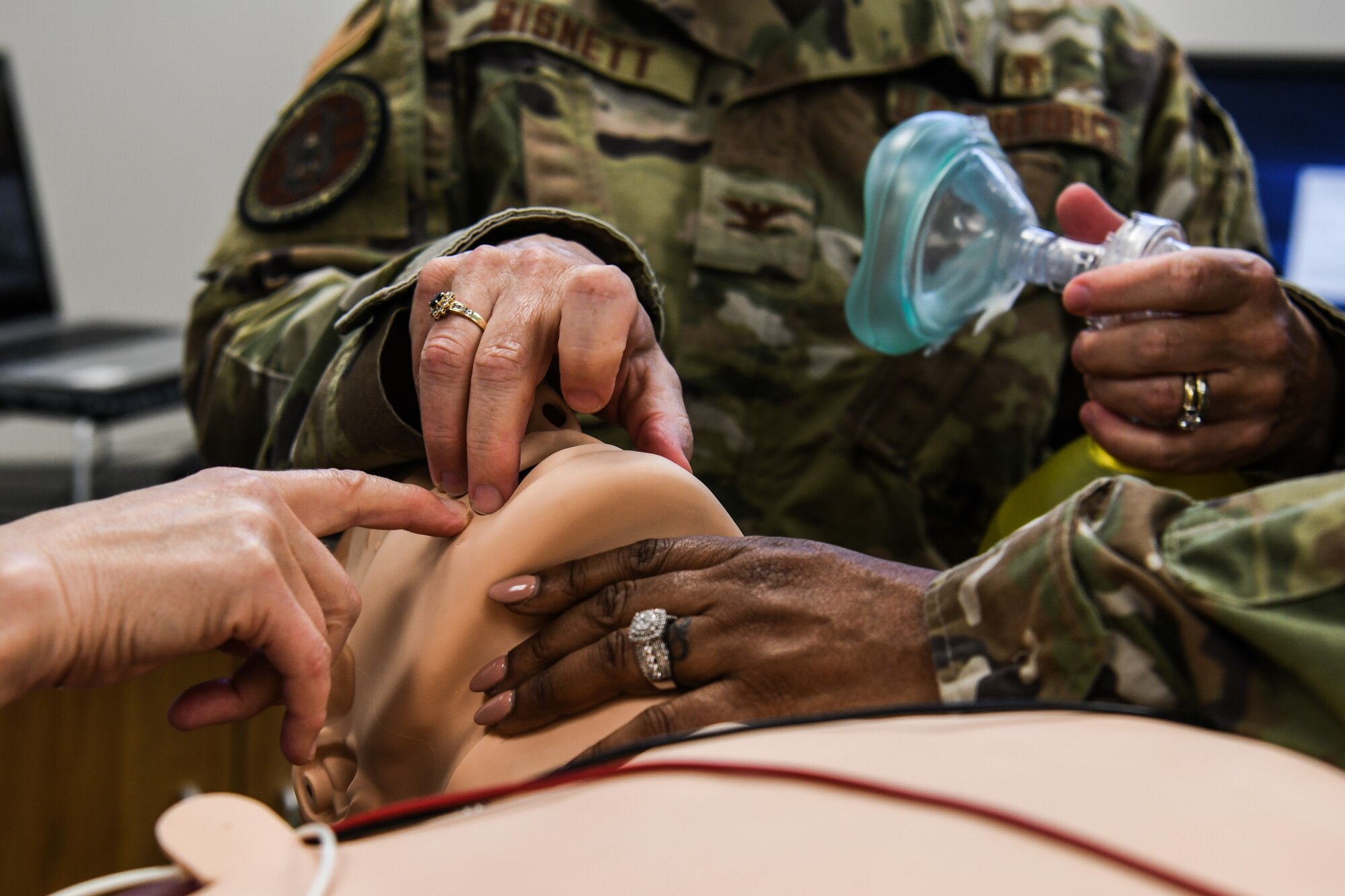 Col. Colleen E. Kelley, 910th Medical Squadron Commander, Col. Teresa Bisnett, Air Force Reserve Command surgeon general, and Chief Master Sgt. Regina Buckhalter, ARFC medical enlisted force chief, check the airway of a trauma SimMan Sept. 12, 2020.