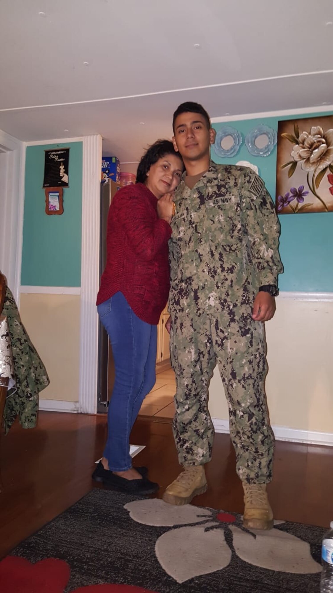 Photo of a Sailor posing with family.