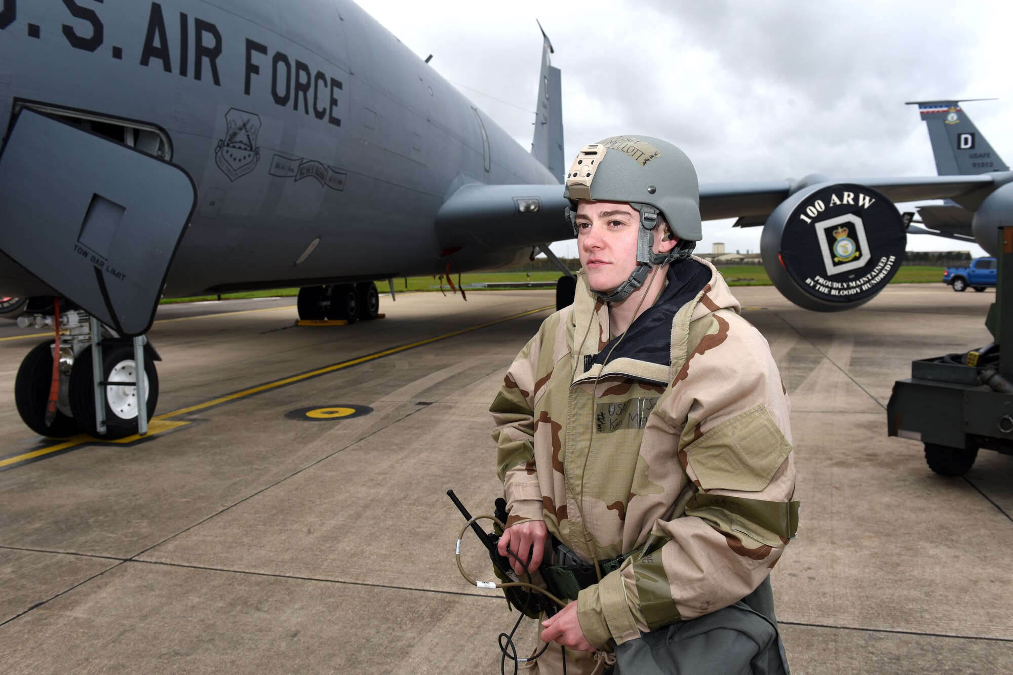 U.S. Air Force Tech. Sgt. Kari Mellott, 100th Aircraft Maintenance Squadron KC-135 Stratotanker aircraft dedicated crew chief, performs a radio check on an in-ear headset to ensure it is working correctly during a chemical, biological, radiological and nuclear Royal Air Force Mildenhall, England, Oct. 28, 2020. Mellott and another crew chief tested the innovative headset, which uses the bones in the user’s ear to transmit sound waves, to test its capabilities while being worn with mission-oriented protective posture gear and ensure they could communicate with aircrew while in the aircraft. (U.S. Air Force photo by Karen Abeyasekere)