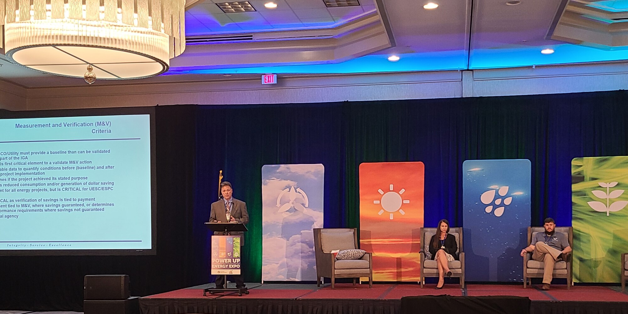 Mike Ringenberg, Air Force Civil Engineer Center Energy Savings Performance Contract and Utility Energy Service Contract program manager, talks with those gathered for the Power Up Energy Expo in Panama City, Florida.