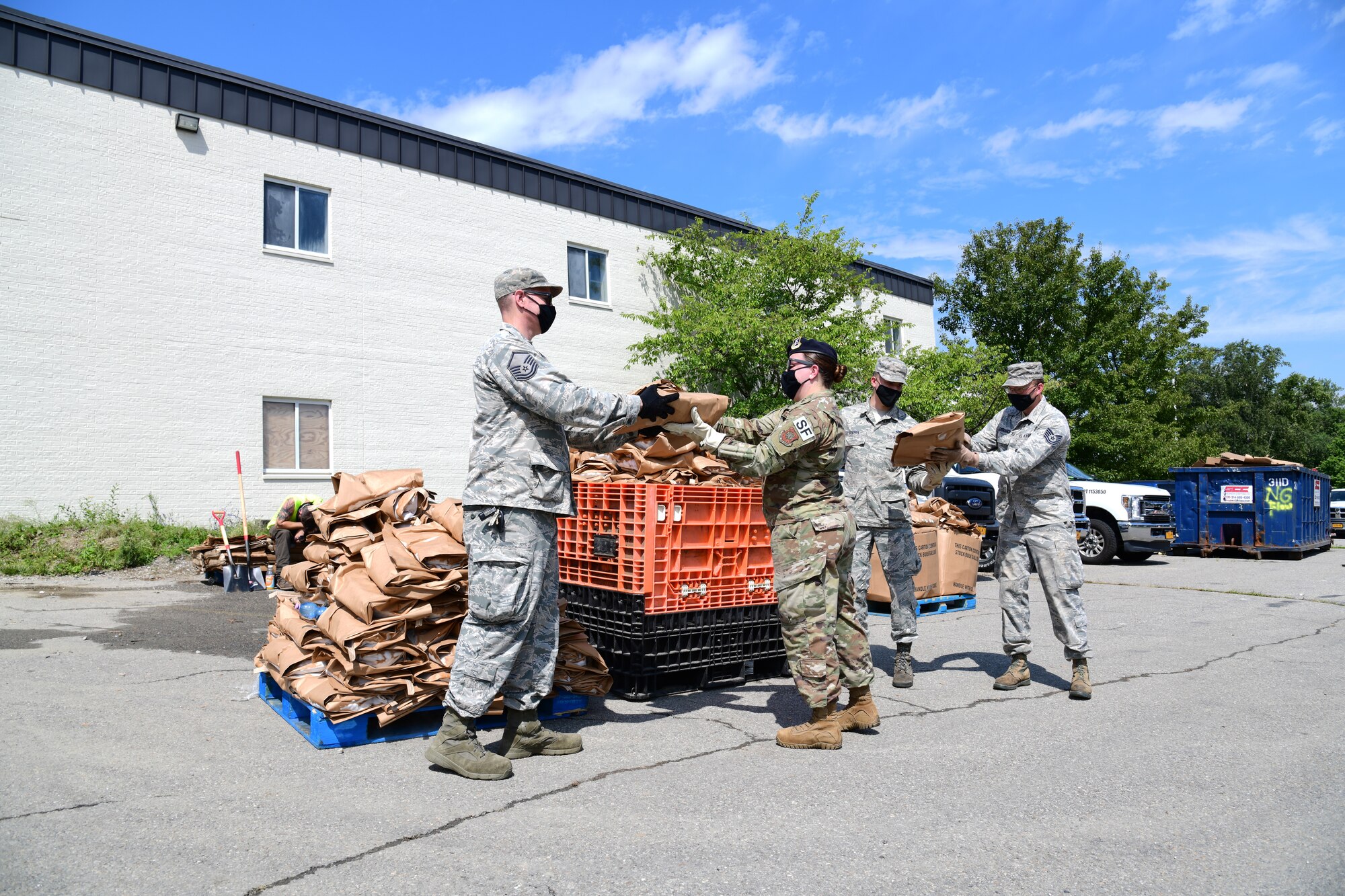 New York Air National Guard Airmen assigned to an Initial Response Force (IRF) from the 105th Airlift Wing based in Newburgh, N.Y. distribute ice and water to Putnam County