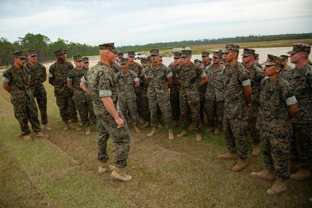 U.S. Maj. Gen. Julian D. Alford, center, commanding general, Marine Corps Installations East-Marine Corps Base Camp Lejeune, gives his remarks following an awards ceremony at the site of the G-36 Company Battle Course Range on MCB Camp Lejeune, North Carolina, Oct. 29, 2020. Alford awarded the Marines the Navy and Marine Corps Commendation Medal for their efforts in building the range. G-36 has been redesigned to enable company commanders to train with organic weapons systems and attachments they would have available during combat and conduct full-scale operations on one range. (U.S. Marine Corps photo by Cpl. Ginnie Lee)