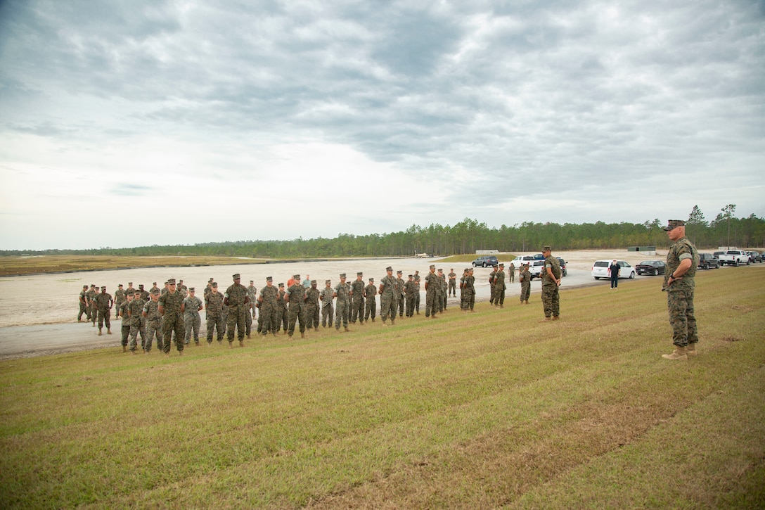 U.S. Marines with 2nd Combat Engineer Battalion and 8th Engineer Support Battalion attend an awards ceremony at the site of the G-36 Company Battle Course Range on Marine Corps Base Camp Lejeune, North Carolina, Oct. 29, 2020. Maj. Gen. Julian D. Alford, commanding general, Marine Corps Installations East-Marine Corps Base Camp Lejeune, awarded the Marines the Navy and Marine Corps Commendation Medal for their efforts in building the range. G-36 has been redesigned to enable company commanders to train with organic weapons systems and attachments they would have available during combat and conduct full-scale operations on one range. (U.S. Marine Corps photo by Cpl. Ginnie Lee)