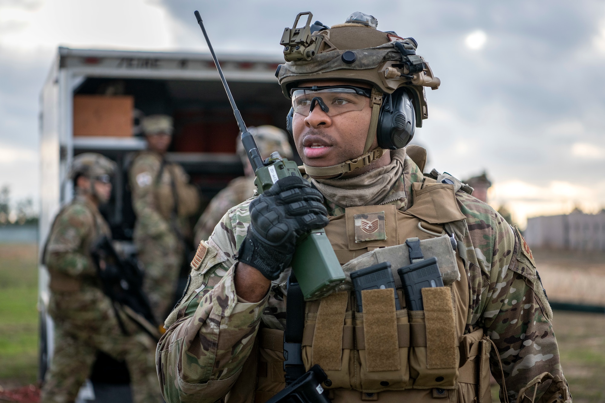 Tech. Sgt. Ali Williams, 921st Contingency Response Squadron, uses a radio to communicate to the security team at Geronimo Landing Zone during the exercise Jan. 17, 2020, at the Joint Readiness Training Center at Fort Polk, Louisiana. Williams was the senior force protection team member for the contingency response element. (U.S. Air Force photo by Tech. Sgt. David W. Carbajal)