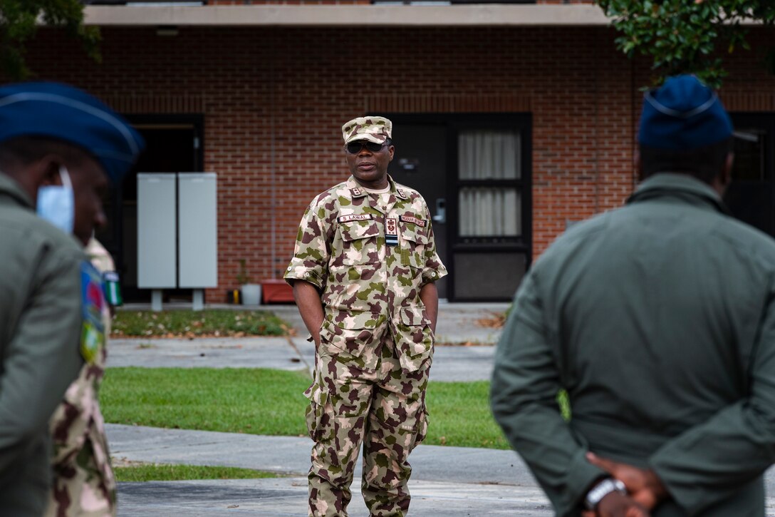 A photo of an Airman addressing other airmen