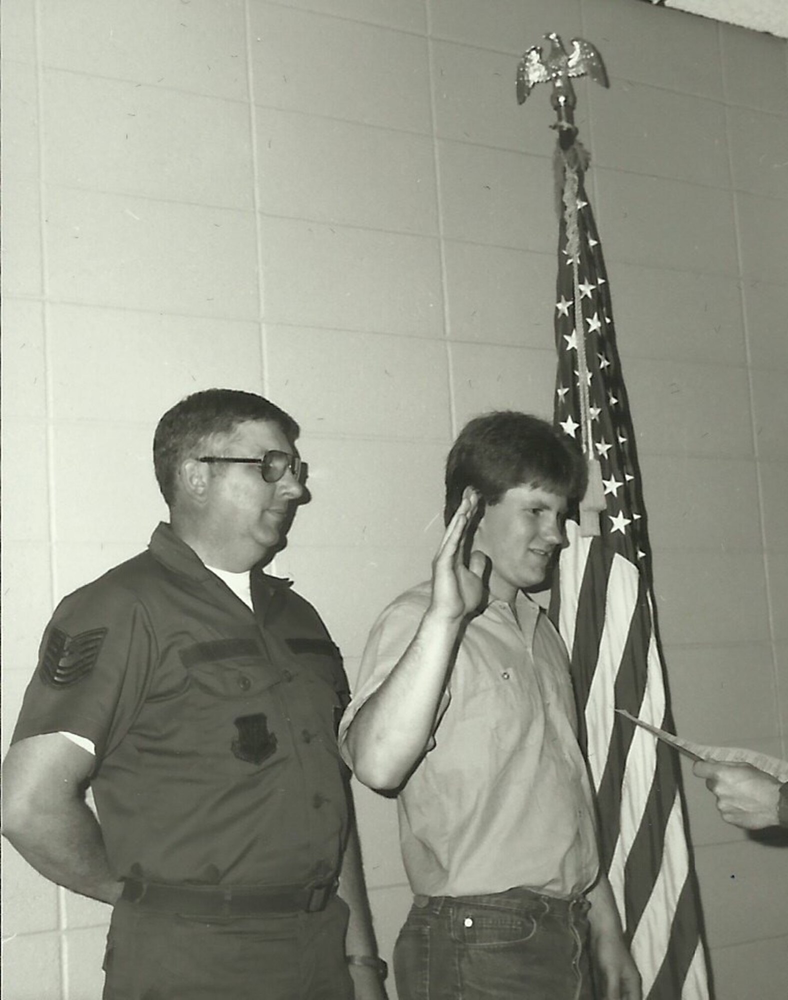 Master Sgt. John Konietzko (ret) watches as his son Kraig Konietzko takes the oath of enlistment at the 148th Fighter Wing in 1985. (courtesy photo)