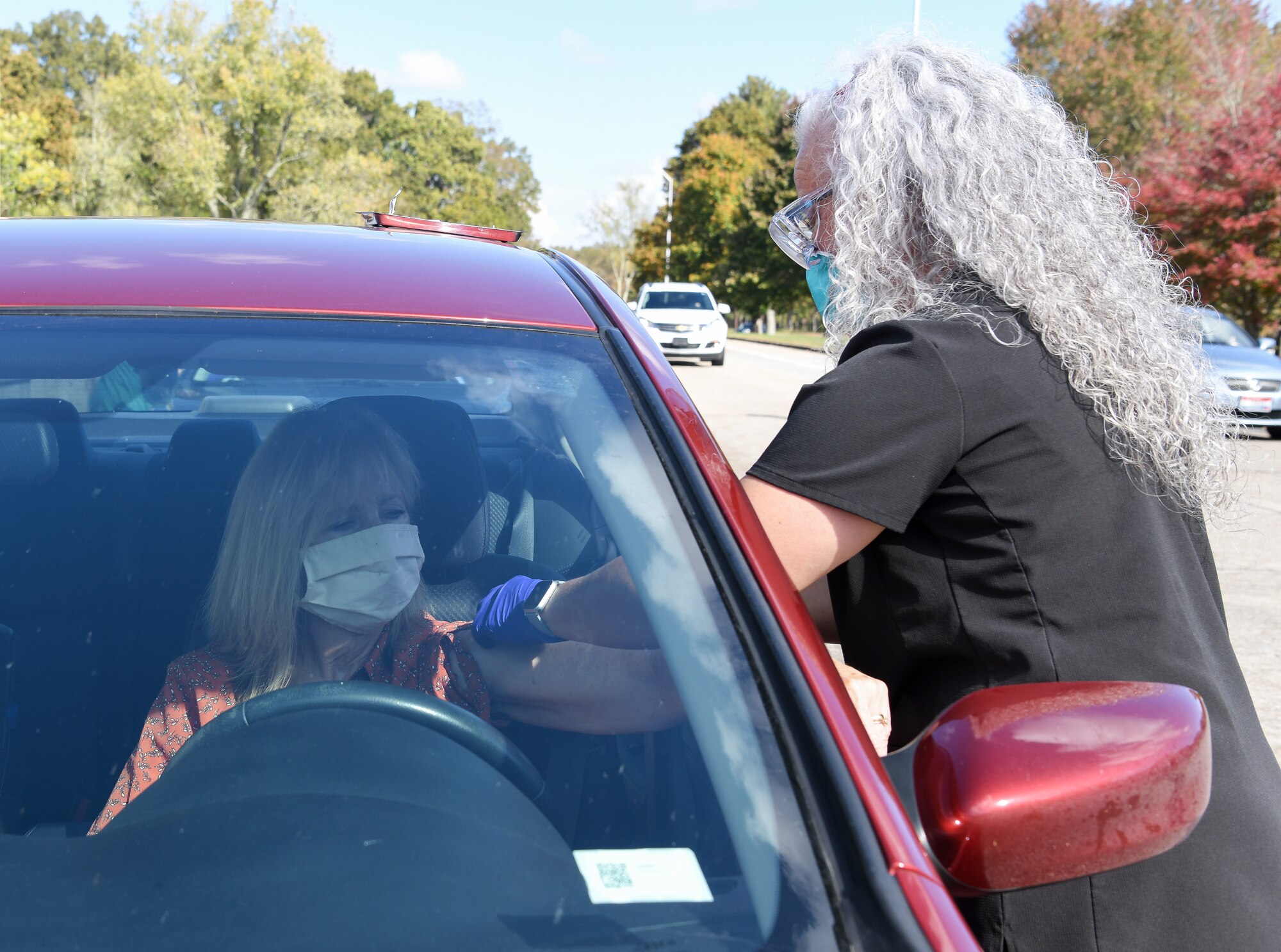 Darla Sain, a registered nurse with the Tennessee Department of Health, administers a flu shot to Betty Rutherford, an Arnold Engineering Development Complex team member, Oct. 21, 2020 at Arnold Air Force Base, Tenn. The Coffee County Health Department, which operates under the Tenn. Dept. of Health, held the clinic for all who could access the base. The shots were provided free of charge. The Centers for Disease Control and Prevention recommend that everyone 6 months old and older receive the flu vaccine every year, with few exceptions. (U.S. Air Force photo by Jill Pickett)