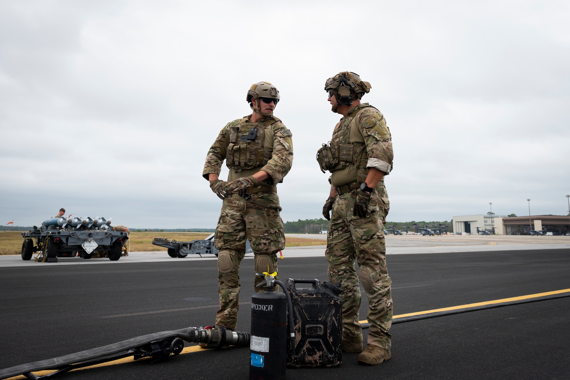 U.S. Air Force Senior Airmen Ryan Ruesewald, left, and Cody Washek, forward area refueling point members assigned to the 1st Special Operations Logistics Readiness Squadron, prepare to conduct a FARP operation during Agile Flag 21-1 at Hurlburt Field, Florida, Oct. 27, 2020.
