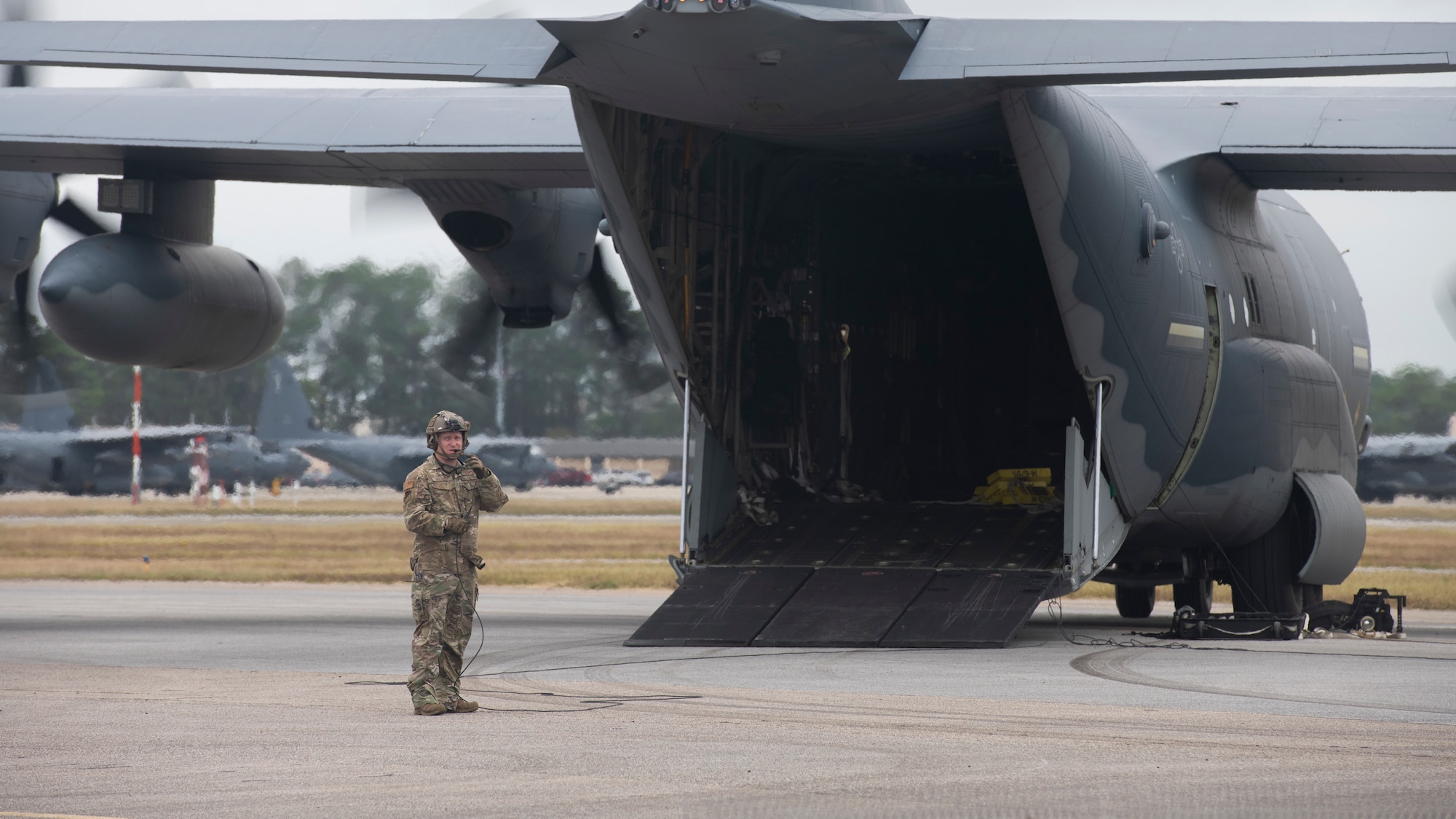 A loadmaster assigned to the 9th Special Operations Squadron communicates with aircrew members on an MC-130J Commando II during Agile Flag 21-1 at Hurlburt Field, Florida, Oct. 27, 2020.