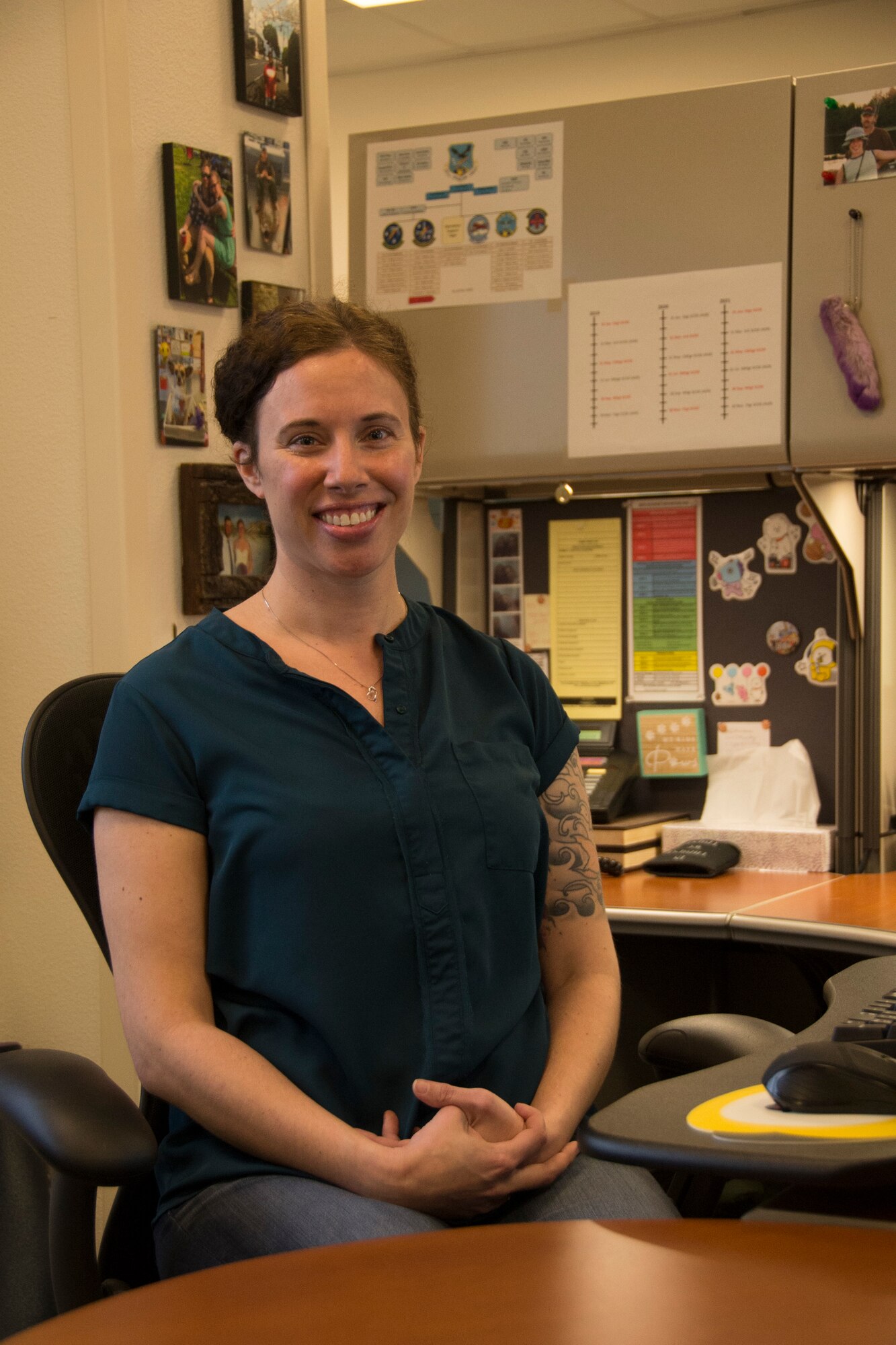 Kate Strain sits at her desk.