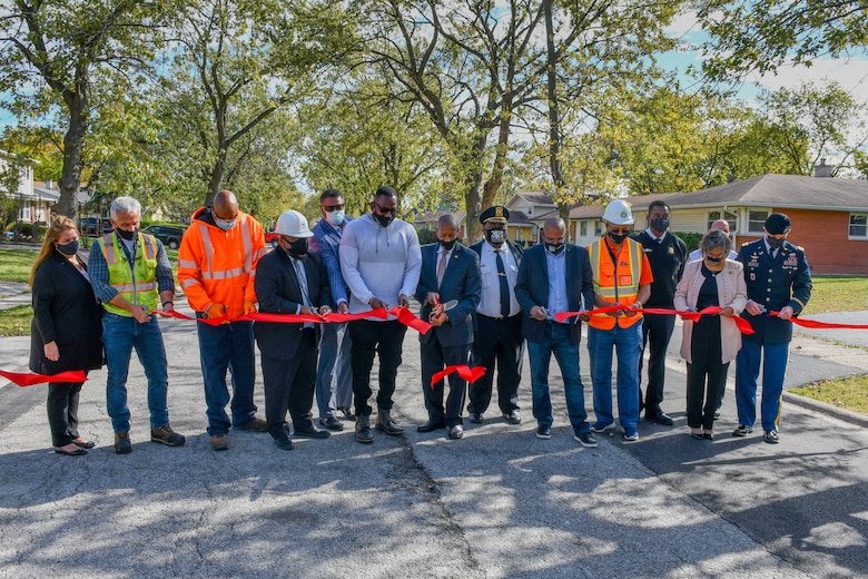 USACE Chicago District Commander Col. Paul Culberson, Rep. Robin Kelly (IL-2), Hazel Crest Mayor Vernard Alsberry Jr., and others cut a ceremonial ribbon during a ceremony to mark the completion of a water main project in Hazel Crest, Illinois, Oct. 13, 2020.