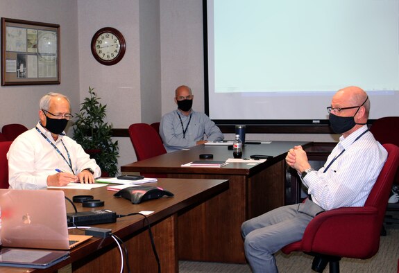 Dr. Rich Tighe, right, general manager of the Test Operations and Sustainment (TOS) contractor for Arnold Engineering Development Complex (AEDC), speaks during a University Consortium and Technical Advisory Board meeting held virtually Oct. 13, 2020, at Arnold Air Force Base, Tenn. Also in attendance, from left, AEDC TOS Deputy General Manager Mike Belzil and Technology Innovations Branch Manager Mark Brandon. (U.S. Air Force photo by Deidre Moon)