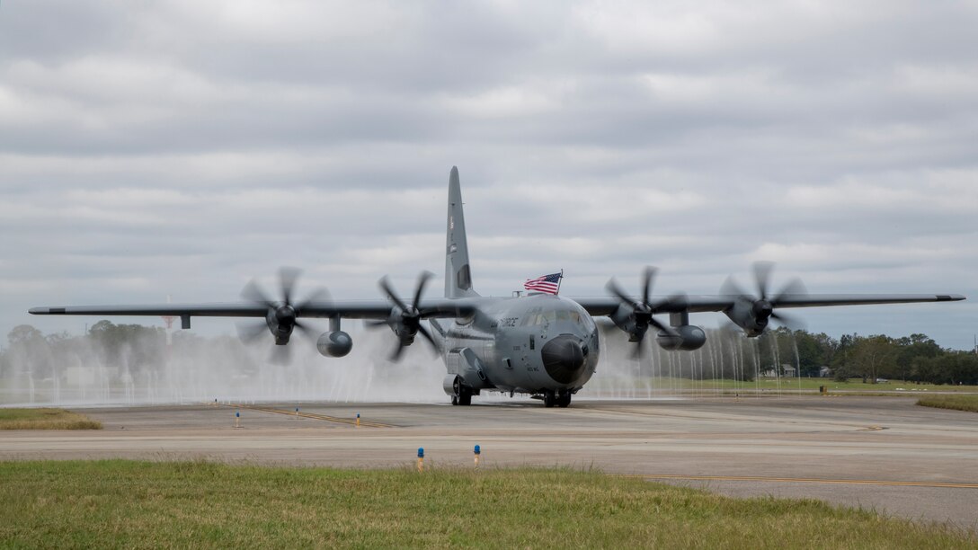 A WC-130J Super Hercules from the 53rd Weather Reconnaissance Squadron taxis through the fresh water rinse, aka bird bath, Oct. 30, 2020 at Keesler Air Force, Mississippi. Aircraft from the 403rd Wing returned from Joint Base San Antonio, Texas, after the fourth evacuation of the year. (U.S. Air Force photo by 2nd Lt. Christopher Carranza)