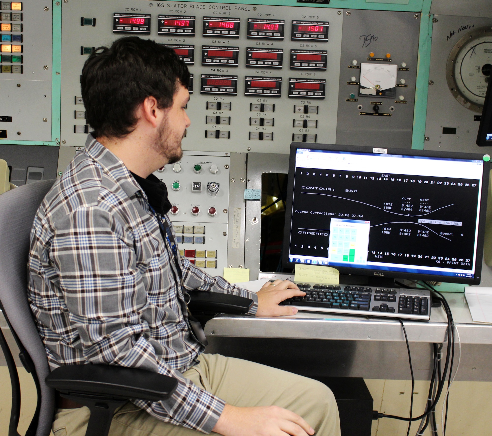 Electrical systems engineer Will Layne views a monitor in the control room of the Arnold Engineering Development Complex 16-foot supersonic wind tunnel Sept. 25, 2020, at Arnold Air Force Base, Tenn. Layne is part of the 16S team assisting with a project to reactivate the nozzle for the test cell. The 16S nozzle was last active in 1997. (U.S. Air Force photo by Deidre Moon) (These photos have been altered by obscuring badges for security purposes.)