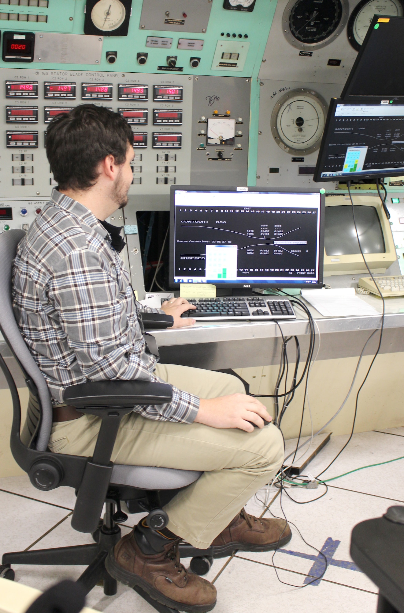 Electrical systems engineer Will Layne views a monitor in the control room of the Arnold Engineering Development Complex 16-foot supersonic wind tunnel Sept. 25, 2020, at Arnold Air Force Base, Tenn. Layne is part of the 16S team assisting with a project to reactivate the nozzle for the test cell. The 16S nozzle was last active in 1997. (U.S. Air Force photo by Deidre Moon) (These photos have been altered by obscuring badges for security purposes.)