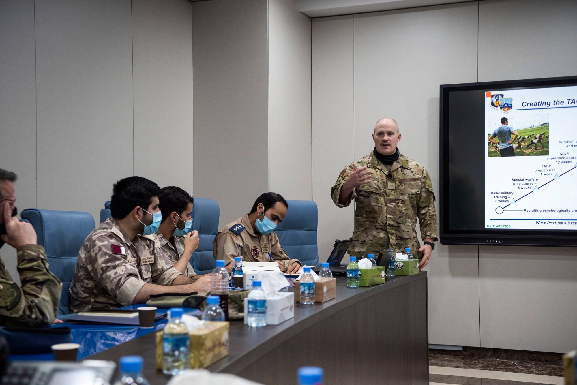 U.S. Air Force Tech. Sgt. Chase Beck, U.S. Air Forces Central Tactical Air Control Party specialist, gives a brief about his career field to Qatar Emiri Air Force members at Al Udied Air Base, Qatar, Oct. 22, 2020.