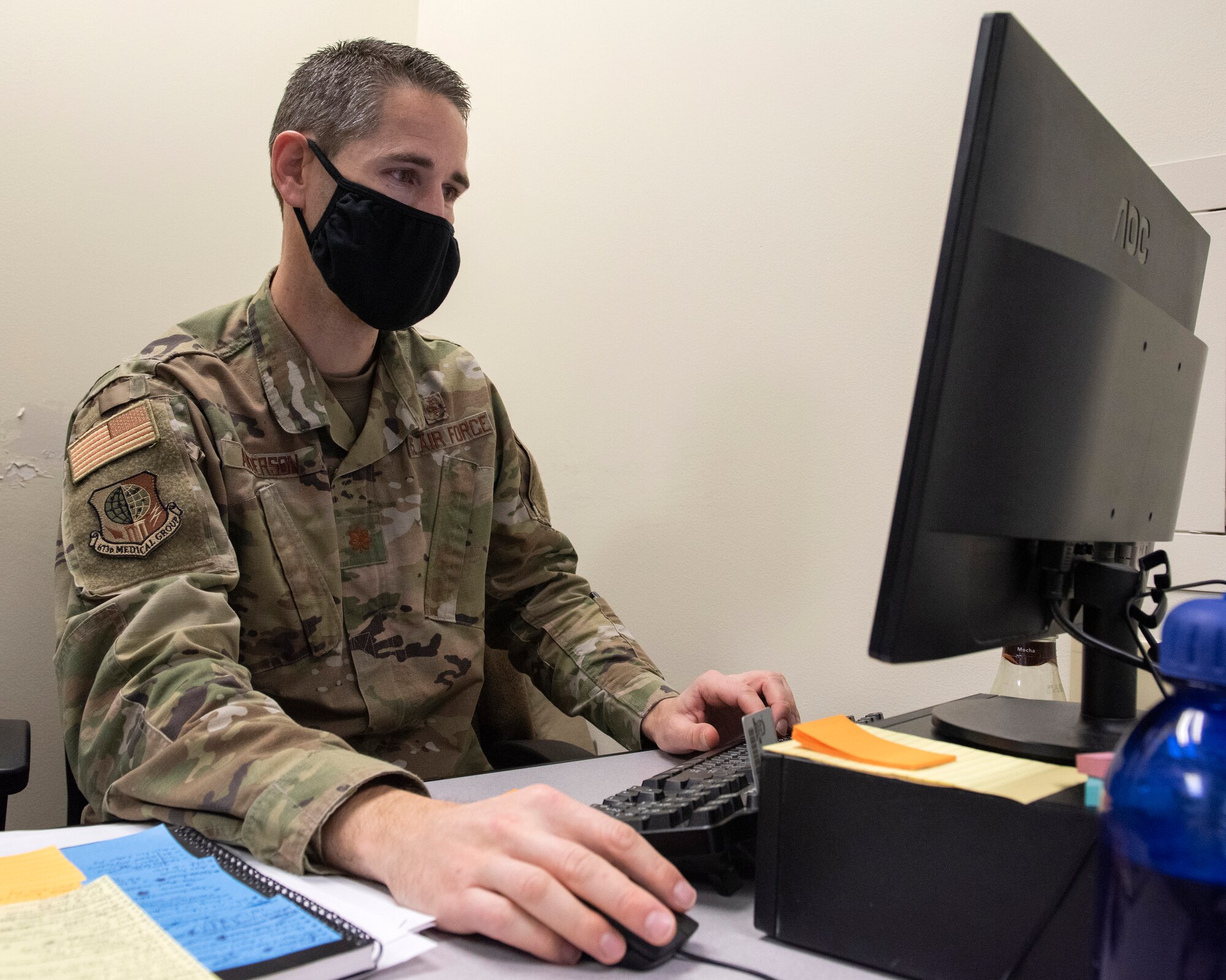 U.S. Air Force Maj. Tim Anderson, the 673d Medical Group Military Health System Genesis program manager, works on integrating MHS Genesis at Joint Base Elmendorf-Richardson, Alaska, Oct. 31, 2020. MHS Genesis is a new military health-records program which streamlines both military and the Department of Veterans Affairs records.