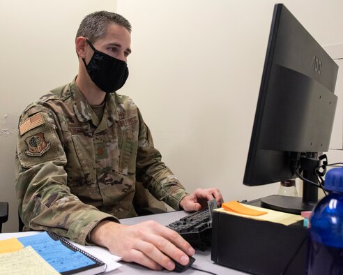 U.S. Air Force Maj. Tim Anderson, the 673d Medical Group Military Health System Genesis program manager, works on integrating MHS Genesis at Joint Base Elmendorf-Richardson, Alaska, Oct. 31, 2020. MHS Genesis is a new military health-records program which streamlines both military and the Department of Veterans Affairs records.