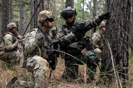 Cpt. Kris Candelaria with Team 513, 5th Security Forces Assistance Brigade, and Indonesian Army 1st Lt. Wilhelmus Raditya, attached to 1st Battalion, 27th Infantry Regiment, 2nd Brigade, 25th Infantry Division, discuss plans for approaching an objective