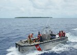 Crew members from the Coast Guard Cutter Sequoia (WLB 215) visit Sonsorol, Palau, to deliver food, fuel, and medicine from the Palau Ministry of Health, Oct. 22, 2020.