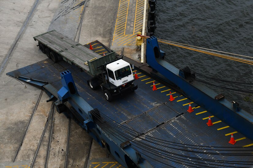 A member assigned to the 841st Transportation Battalion loads a vehicle onto a vessel at Joint Base Charleston’s Naval Weapons Station, S.C., Oct. 29, 2020. The battalion’s efforts helped support the transportation of assets to Southwest Asia. The 841st TB facilitates the movement for all eastern seaboard cargo movements.