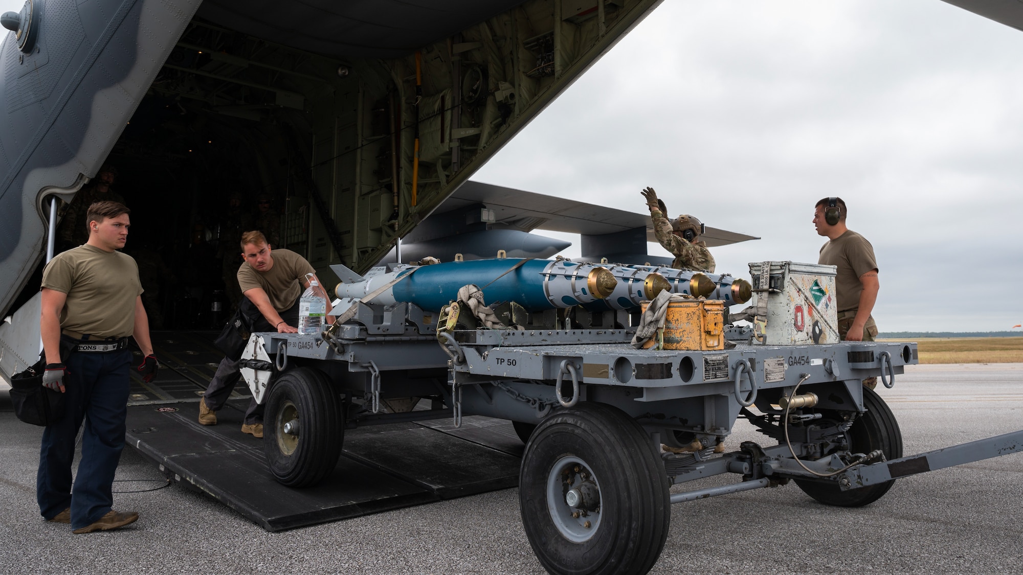 Airmen off loading munitions