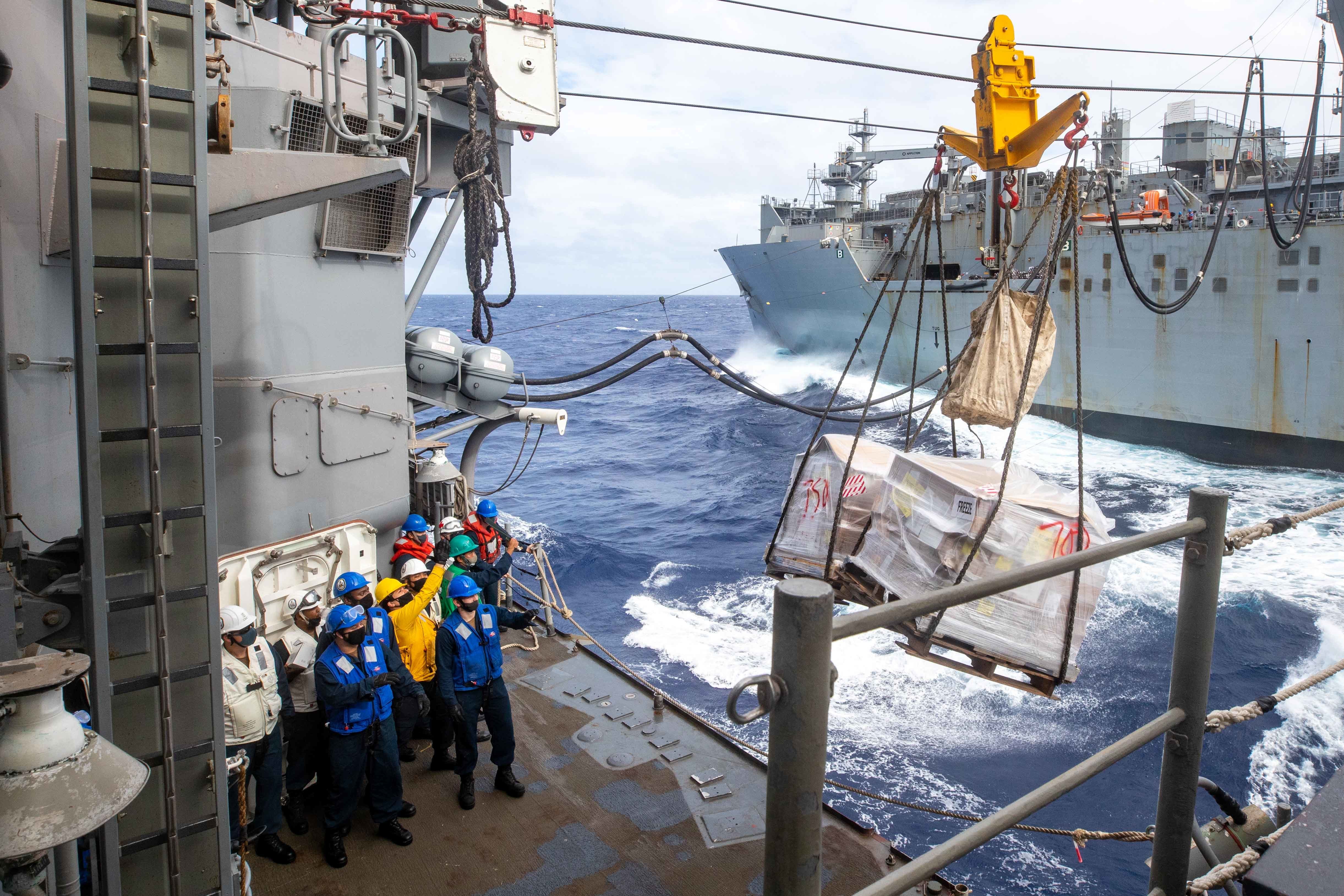 USS Shiloh (CG 67) conducts a replenishment-at-sea with USNS Alan Shepard (T-AKE 3).