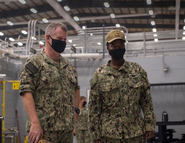 201103-N-KZ419-2051 NAVAL SUPPORT ACTIVITY BAHRAIN (Nov. 3, 2020) Vice Adm. Samuel Paparo, left, commander of U.S. Naval Forces Central Command, U.S. 5th Fleet and Combined Maritime Forces, speaks with Hull Maintenance Technician 1st Class Loveasia Vann during a visit to Commander Naval Surface Squadron 5 in Bahrain, Nov. 3. The U.S. 5th Fleet area of operations encompasses nearly 2.5 million square miles of water area and includes the Arabian Gulf, Gulf of Oman, Red Sea and parts of the Indian Ocean. The region is comprised of 20 countries and includes three critical choke points at the Strait of Hormuz, the Suez Canal and the Strait of Bab-al-Mandeb at the southern tip of Yemen. (U.S. Navy photo by Mass Communication Specialist 3rd Class Dawson Roth)