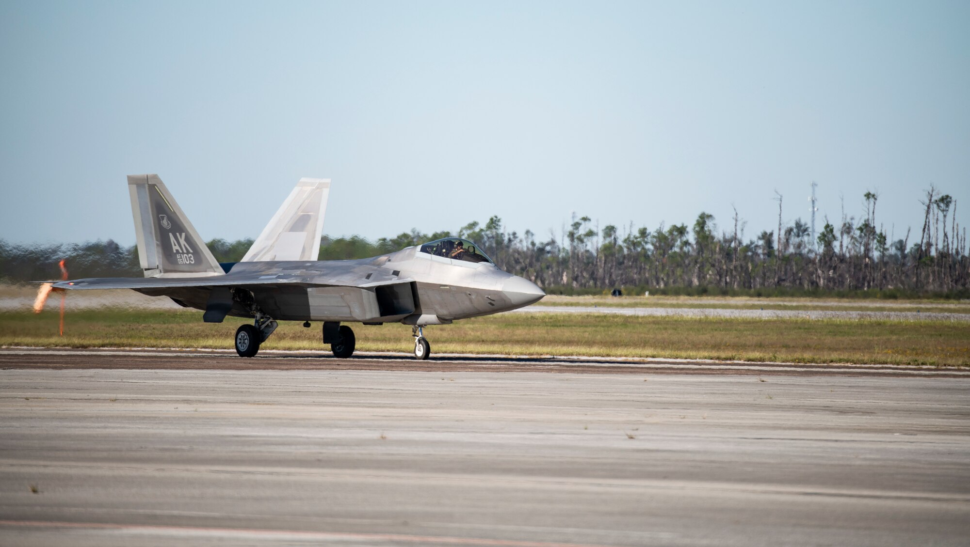 An F-22 Raptor assigned to the 90th Fighter Squadron from Joint Base Elmendorf-Richardson, Alaska, lands at Tyndall Air Force Base, Florida, Oct. 30, 2020. The aircraft arrived to participate in a large scale air-to-air combat exercise known as Checkered Flag. (U.S. Air Force photo by Airman 1st Class Tiffany Price)