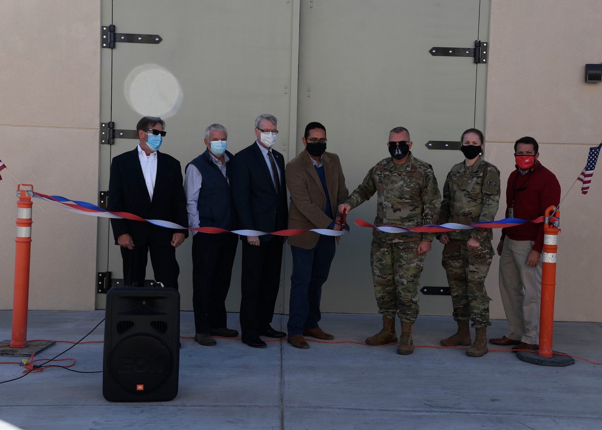 Members of the Air Force Research Laboratory Space Vehicles Directorate and U.S. Army Corps of Engineers celebrate the opening of the Deployable Structures Laboratory at Kirtland Air Force Base, New Mexico, Oct. 29, 2020. The laboratory was constructed by Sky Blue Builders and designed by Studio Southwest Architects, both of Albuquerque, N.M., and will be used for testing novel deployable space structures. (U.S. Air Force photo by Airman 1st Class Ireland Summers)