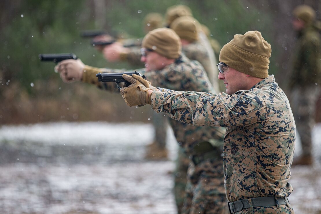 U.S. Marines fire M9 pistols during a qualification range as part of Marine Expeditionary Force 21.1 on Fort Drum, New York Nov. 2.