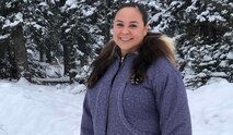 Staff Sgt. Samantha Dehling, the supply sergeant for the 49th Missile Defense Battalion, Alaska Army National Guard, stands for a photo at her home in Delta Junction in her grandmother's parka lined with wolverine ruff and trimmed with beaver fur cuffs. Dehling is from Noorvik, Alaska, and has served in the Alaska Army National since 2001. (Courtesy photo)