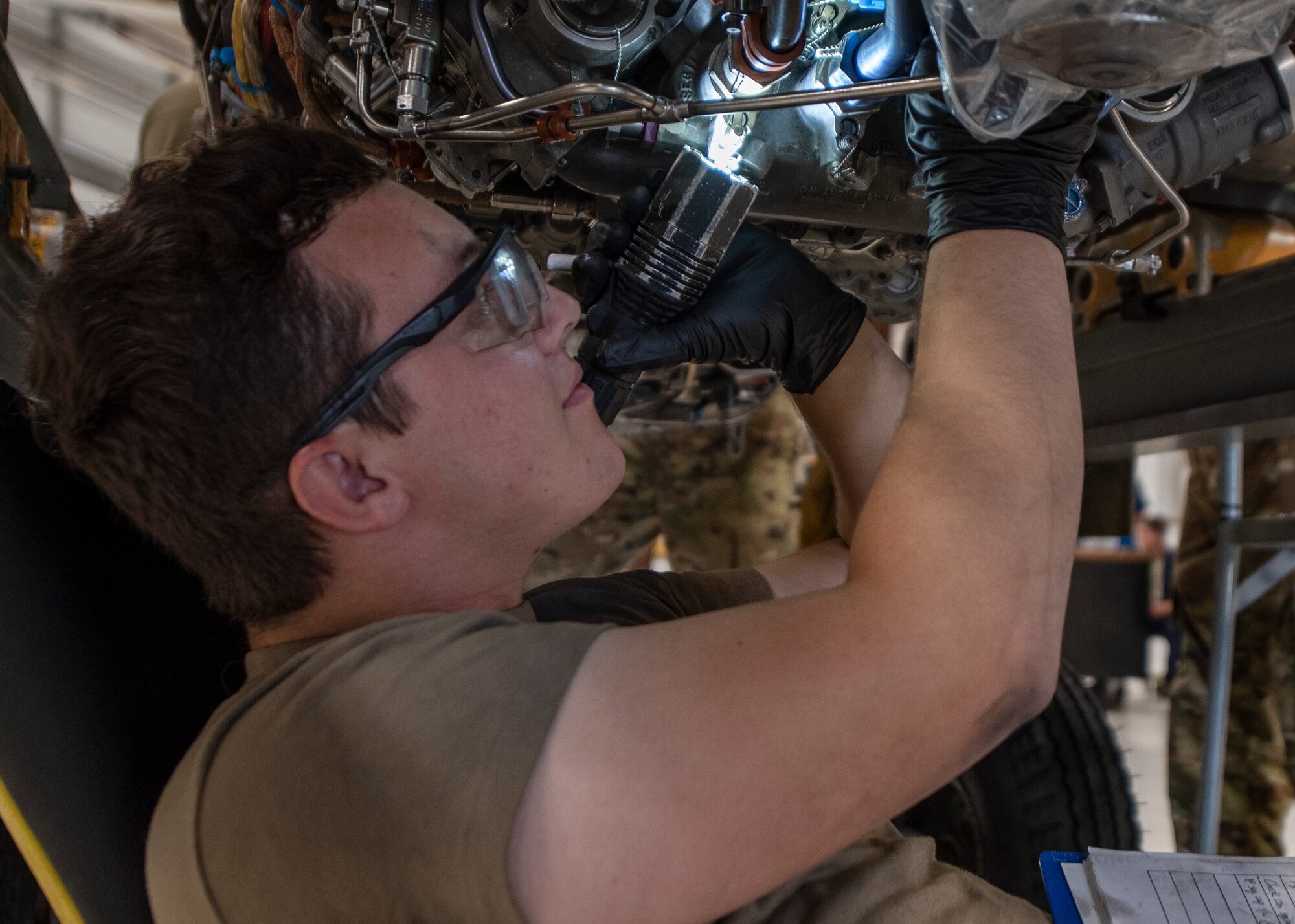 Airman 1st Class Jarrett Franklin, 4th Component Maintenance Squadron aerospace propulsion technician, inspects an F-15E Strike Eagle engine for safety discrepancies at Seymour Johnson Air Force Base, North Carolina, Oct. 28, 2020.