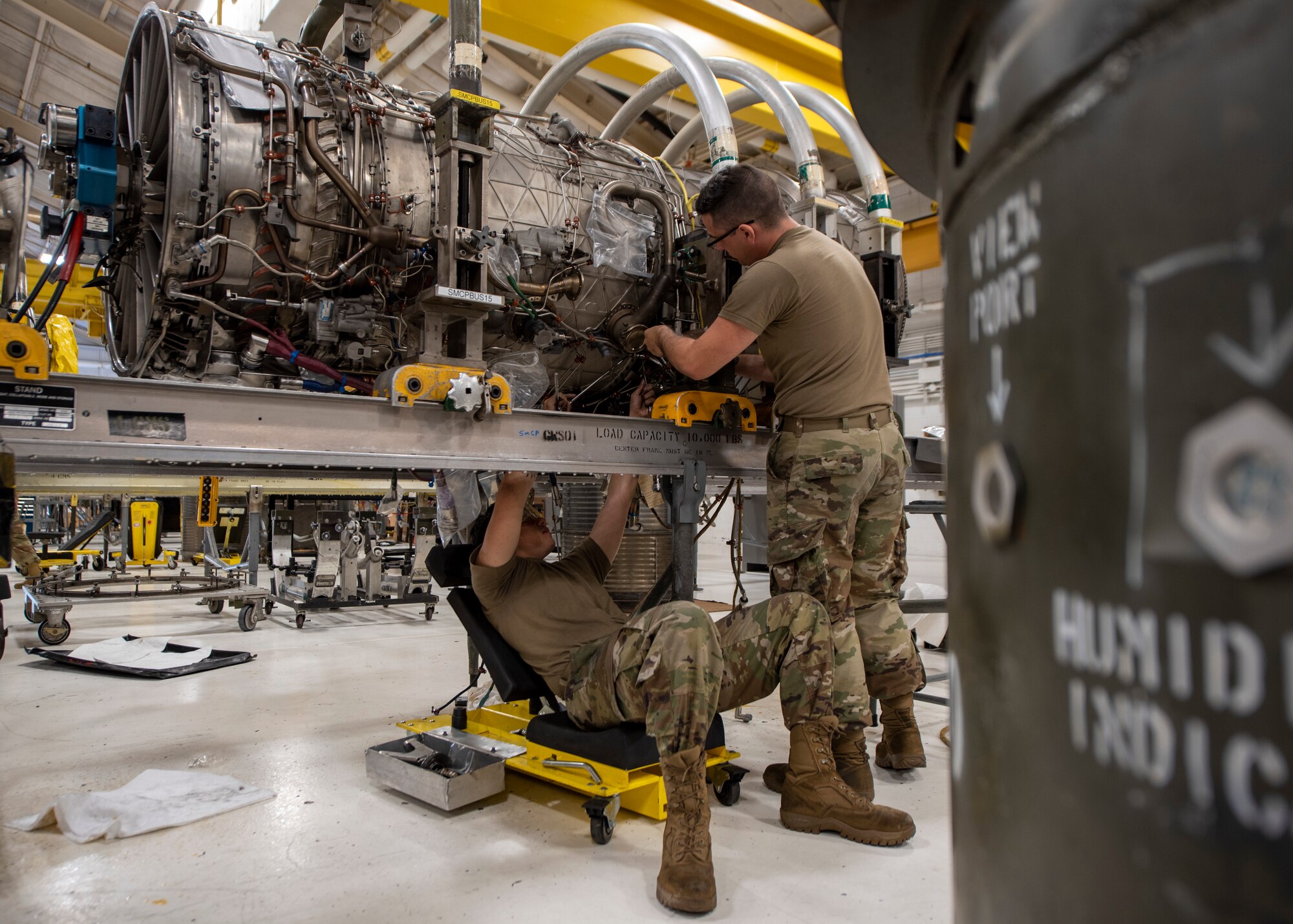 Airman Gaven Shanks, 4th Component Maintenance Squadron aerospace propulsion technician (left), and Airman 1st Class Taran Walsh, 4 CMS aerospace propulsion apprentice, work on an F-15E Strike Eagle engine at Seymour Johnson Air Force Base, North Carolina, Oct. 28, 2020.