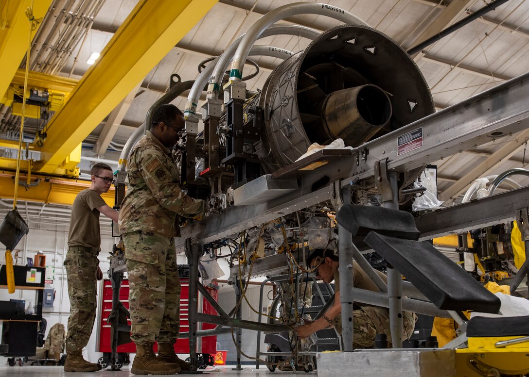 Airmen assigned to the 4th Component Maintenance Squadron aerospace propulsion shop work on an F-15E Strike Eagle engine at Seymour Johnson Air Force Base, North Carolina, Oct. 28, 2020.