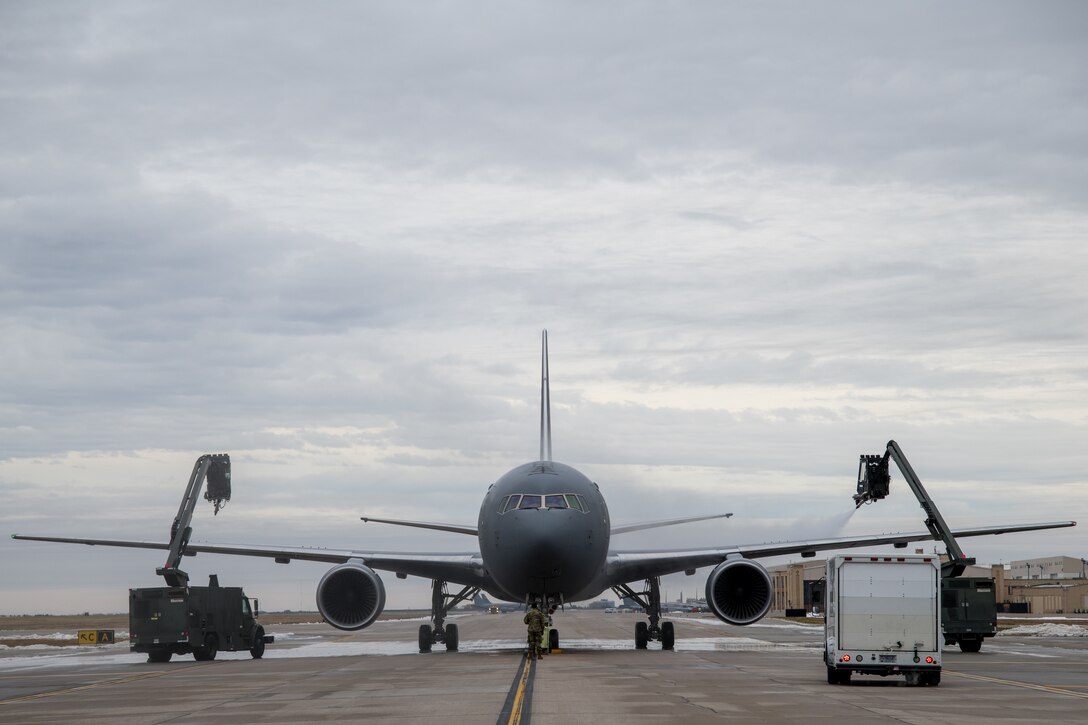 Airmen from the 22nd Maintenance Squadron de-ice the wings of a KC-46A Pegasus using Global GL1800 de-ice trucks Oct. 28, 2020, at McConnell Air Force Base, Kansas.