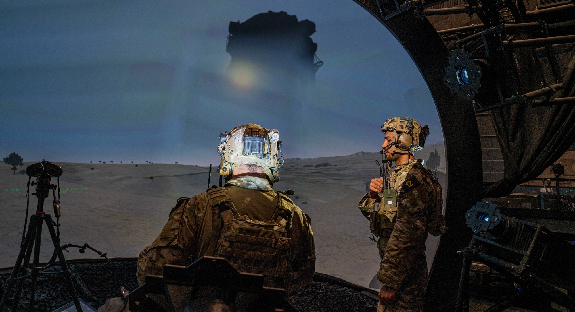Airmen work in simulator