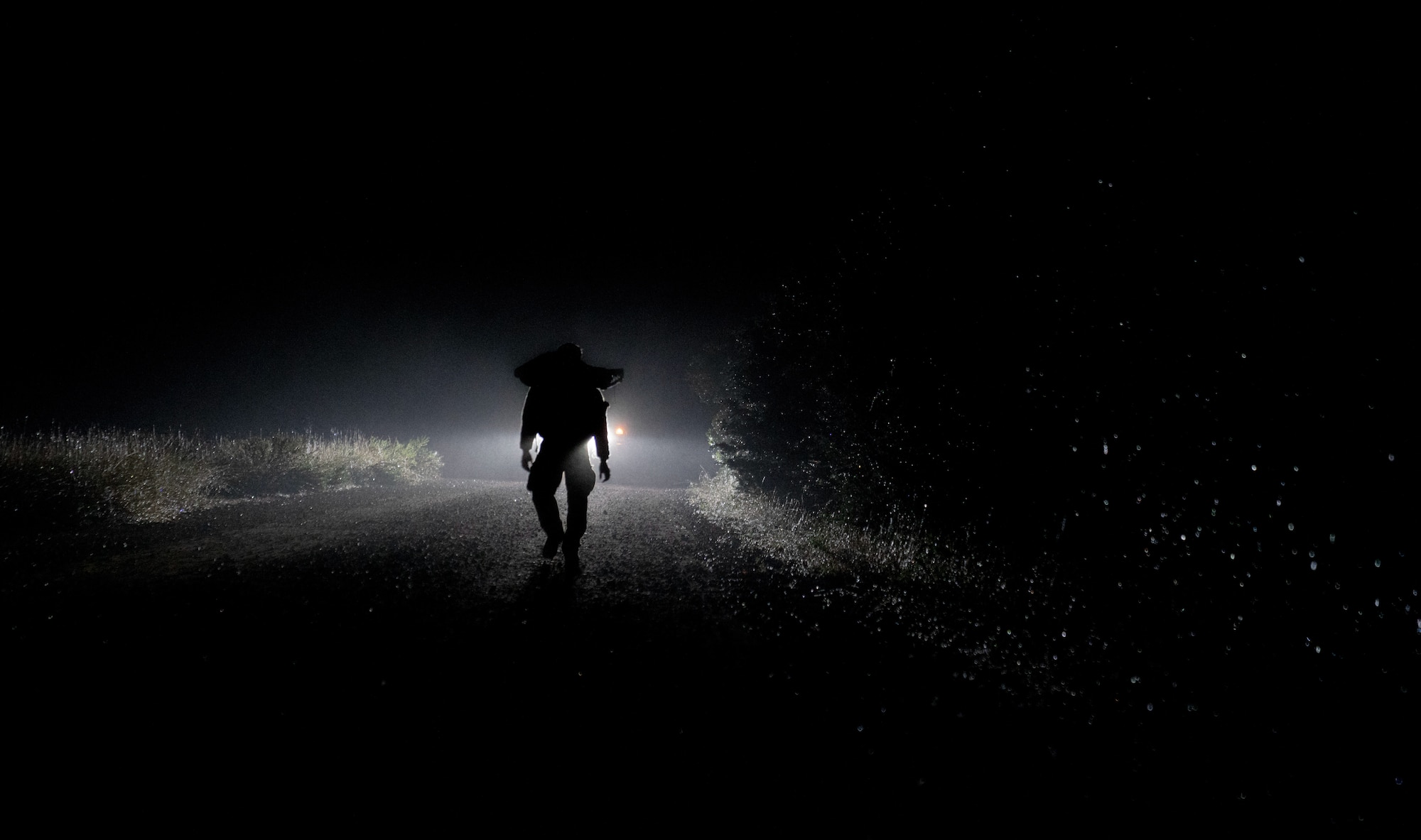 Airmen walking at night