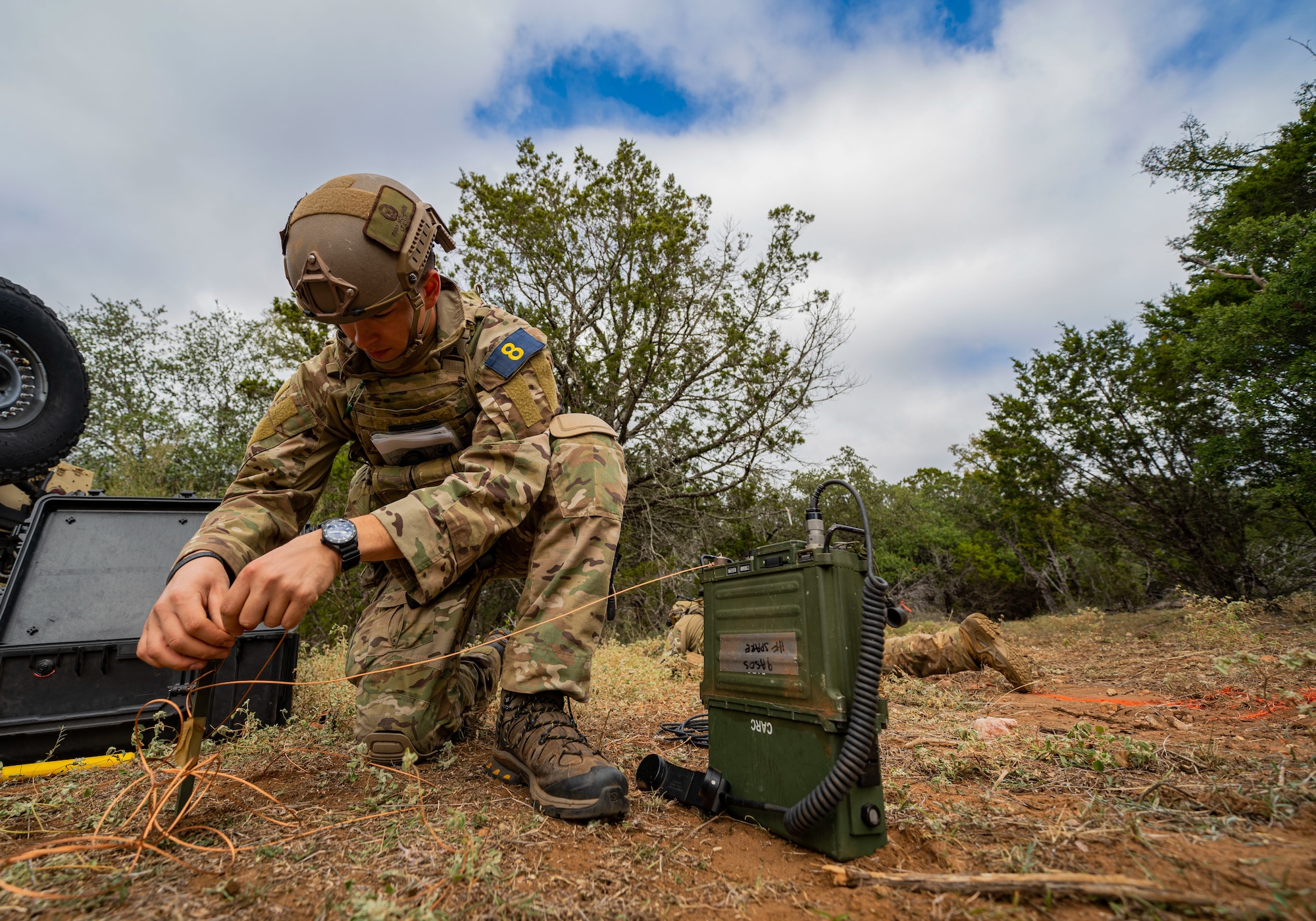 Airmen adjusts radio